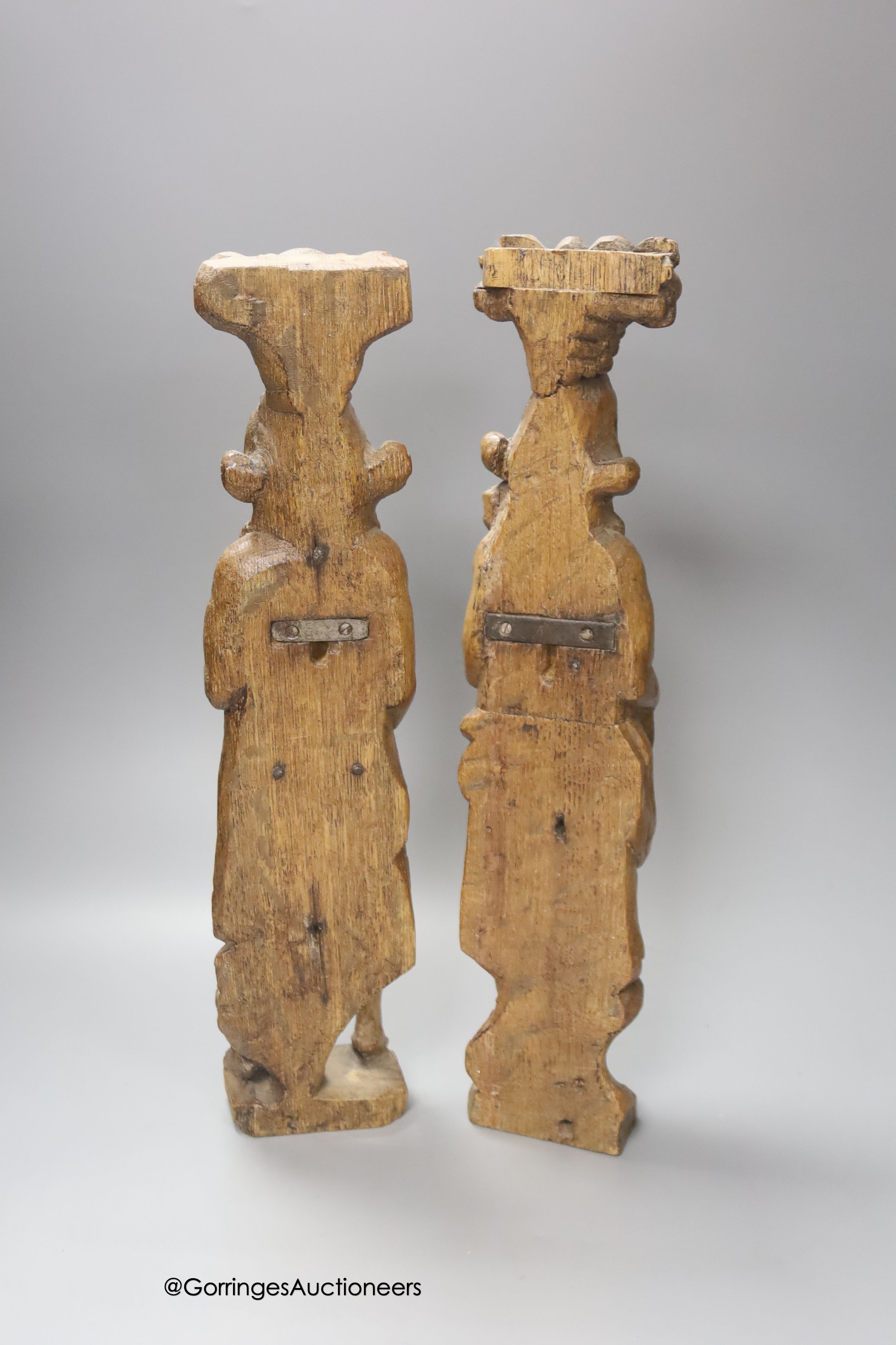 A pair of 17th century carved oak figures 41cm